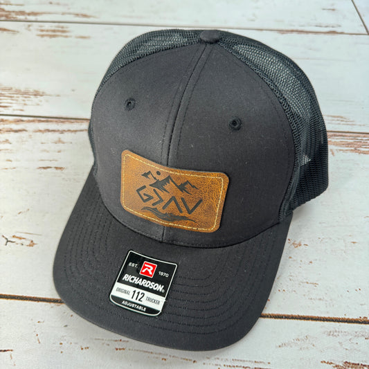 God Is Greater Patch (Black) Trucker Hat